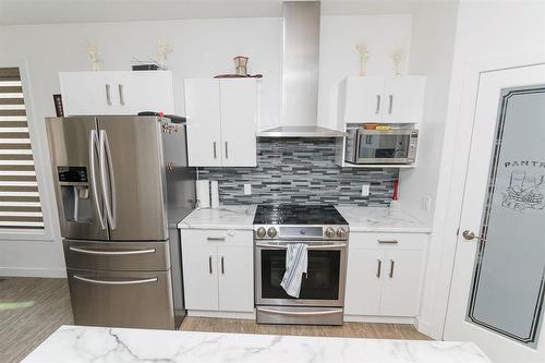 1 Warbler Way, Winkler, MB - Indoor Photo Showing Kitchen With Stainless Steel Kitchen