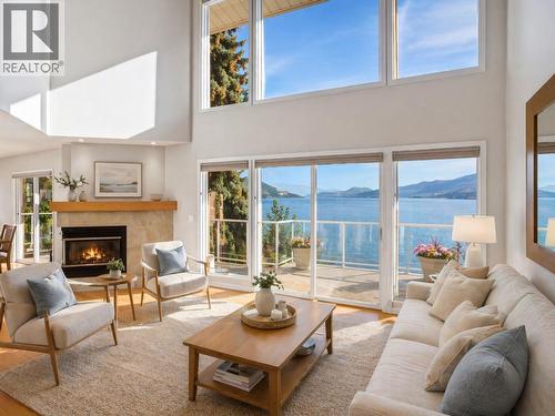 Virtually staged for illustrative purposes. - 1988 Dewdney Road, Kelowna, BC - Indoor Photo Showing Living Room With Fireplace