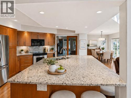 Virtually staged for illustrative purposes. - 1988 Dewdney Road, Kelowna, BC - Indoor Photo Showing Kitchen With Double Sink With Upgraded Kitchen