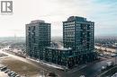 Contemporary multi-story buildings featuring dark facade panels and extensive window arrays - 4878 Powers Common Unit# 1108, Burlington, ON  - Outdoor 