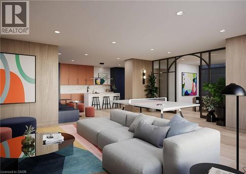 Open-concept communal area featuring light wood-finish flooring, recessed lighting, a built-in kitchen island with bar seating, a ping-pong table, and a partitioned space with a dark-framed arched doo - 4878 Powers Common Unit# 1108, Burlington, ON - Indoor Photo Showing Other Room