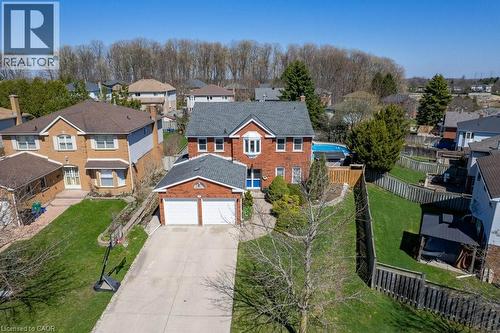 Brick exterior residence featuring a two-car garage, concrete driveway, and established landscaping - 44 Lorilee Crescent, Kitchener, ON - Outdoor