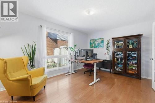 Bright room featuring wood-finish flooring, a large window with blinds, light gray walls, and a ceiling-mounted light fixture - 44 Lorilee Crescent, Kitchener, ON - Indoor Photo Showing Office
