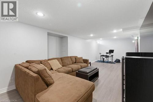 Recessed lighting illuminates this expansive space featuring light wood-finish flooring and bright white walls - 44 Lorilee Crescent, Kitchener, ON - Indoor