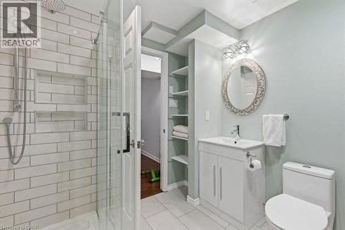 Bathroom featuring a glass-enclosed shower with subway tile, built-in shower niches, and a rainfall showerhead - 44 Lorilee Crescent, Kitchener, ON - Indoor Photo Showing Bathroom