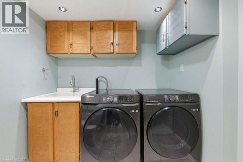 Laundry room with built-in cabinetry, utility sink, and recessed lighting - 44 Lorilee Crescent, Kitchener, ON - Indoor Photo Showing Laundry Room