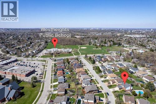 Aerial perspective showcasing the residential neighborhood with a public school and expansive green space - 44 Lorilee Crescent, Kitchener, ON - Outdoor With View