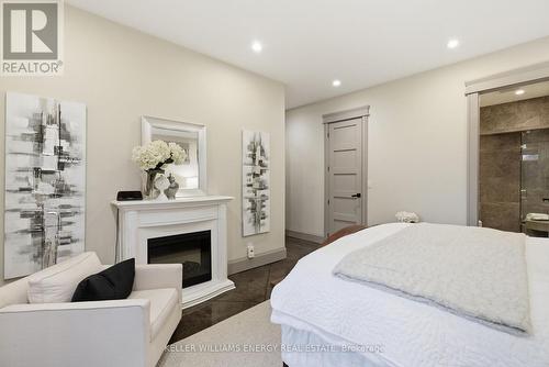 4858 Trulls Road, Clarington, ON - Indoor Photo Showing Bedroom With Fireplace