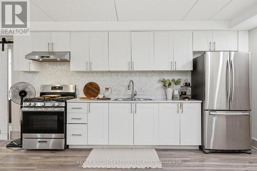4858 Trulls Road, Clarington, ON - Indoor Photo Showing Kitchen With Double Sink With Upgraded Kitchen