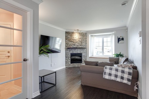 Living Room - 71 Mtée De St-Sulpice, Saint-Sulpice, QC - Indoor Photo Showing Living Room With Fireplace