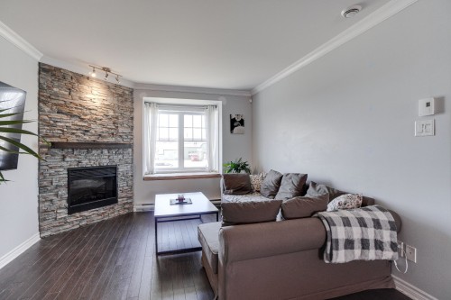 Living Room - 71 Mtée De St-Sulpice, Saint-Sulpice, QC - Indoor Photo Showing Living Room With Fireplace