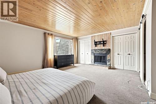 1106 Gryphons Walk, Regina, SK - Indoor Photo Showing Bedroom With Fireplace