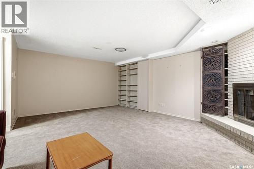 1106 Gryphons Walk, Regina, SK - Indoor Photo Showing Other Room With Fireplace