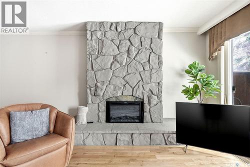 1106 Gryphons Walk, Regina, SK - Indoor Photo Showing Living Room With Fireplace