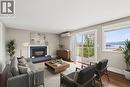 **virtually staged** - 3940 Angus Drive, West Kelowna, BC  - Indoor Photo Showing Living Room With Fireplace 