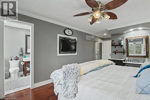 Bedroom featuring wood-finish flooring, a ceiling fan with integrated lighting, and crown molding - 2324 Homer Drive, Burlington, ON - Indoor Photo Showing Bathroom