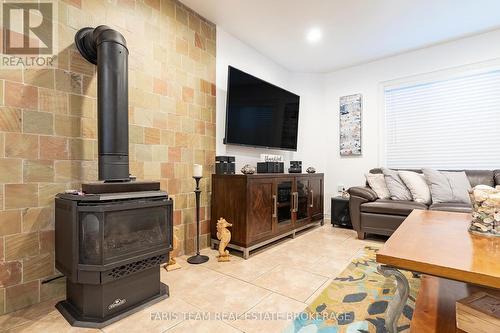 100 Desroches Trail, Tiny, ON - Indoor Photo Showing Other Room With Fireplace