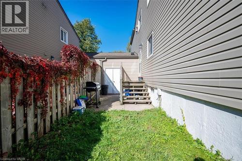 Fenced yard space with a detached garage structure - 168 Silver Aspen Crescent, Kitchener, ON - Outdoor