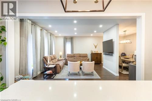 Family area with dark wood-style floors, recessed lighting - 49 Scots Pine Trail, Kitchener, ON - Indoor