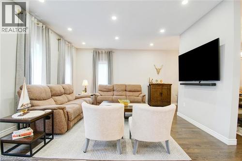 Family room with recessed lighting and wood-style flooring - 49 Scots Pine Trail, Kitchener, ON - Indoor Photo Showing Other Room
