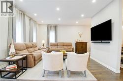 Family room with recessed lighting and wood-style flooring - 