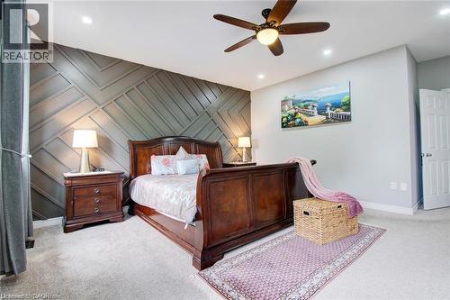 Bedroom featuring an accent wall, a ceiling fan, light carpet, and recessed lighting - 49 Scots Pine Trail, Kitchener, ON - Indoor Photo Showing Bedroom