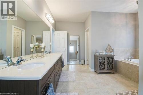 Full bathroom with double vanity, a bath, and light tile patterned floors - 49 Scots Pine Trail, Kitchener, ON - Indoor Photo Showing Bathroom