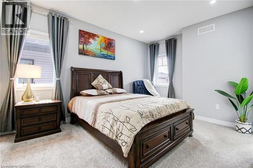 Bedroom featuring light carpet and recessed lighting - 49 Scots Pine Trail, Kitchener, ON - Indoor Photo Showing Bedroom