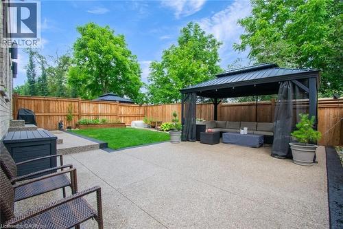 Fenced backyard with outdoor lounge area, a patio area, and a gazebo - 49 Scots Pine Trail, Kitchener, ON - Outdoor