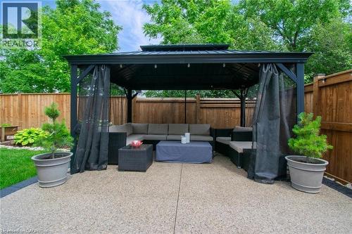 Fenced backyard featuring an outdoor living space, a gazebo, and a patio - 49 Scots Pine Trail, Kitchener, ON - Outdoor