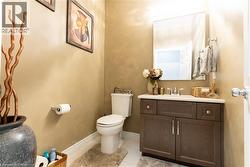 Bathroom featuring vanity and light tile patterned flooring - 
