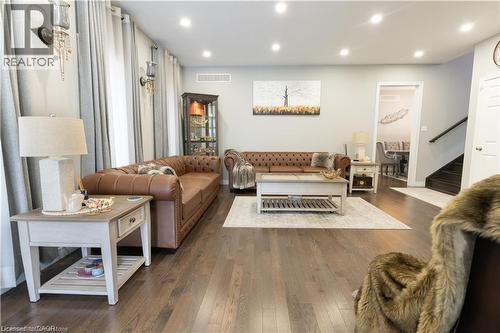 Living area featuring recessed lighting, dark wood-style flooring, and stairway - 49 Scots Pine Trail, Kitchener, ON - Indoor