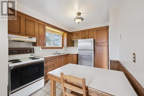 Functional Eat-In Kitchen - 4169 Wilcox Road, Mississauga, ON - Indoor Photo Showing Kitchen With Double Sink