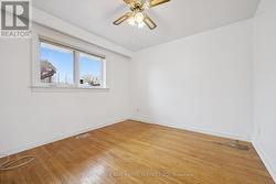 Primary Bedroom with Hardwood Flooring - 