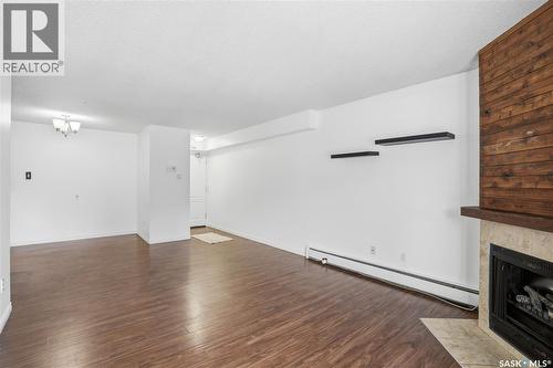 104D2 1121 Mckercher Drive, Saskatoon, SK - Indoor With Fireplace