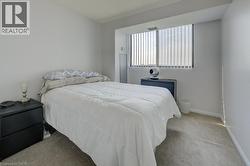 Carpeted bedroom with baseboards - 