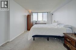 Bedroom with carpet floors and a textured ceiling - 