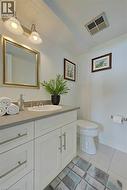 Half bathroom featuring vanity and light tile patterned floors Virtually Staged - 