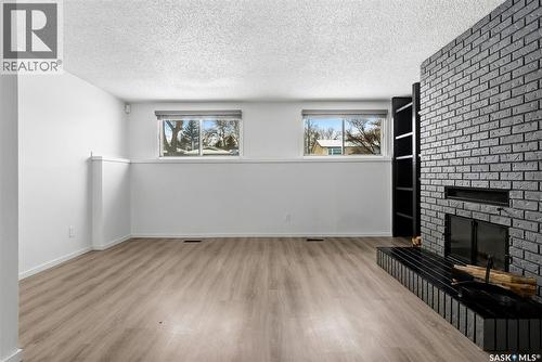 15 Rutley Street, Regina, SK - Indoor Photo Showing Other Room With Fireplace