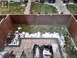 Fenced backyard with interlock - 