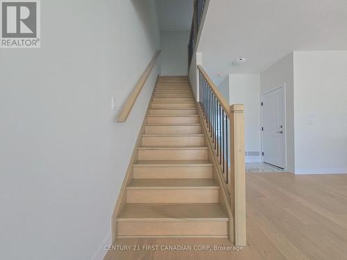 Upper Hallway with Poplar Railing & Metal Spindles - 4297 Calhoun Way, London South (South V), ON - Indoor Photo Showing Other Room