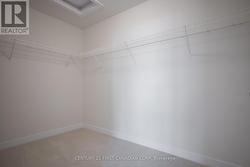 Primary Walk-In Closet - 
