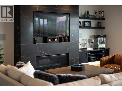 5650 The Edge Place Unit# 111, Kelowna, BC - Indoor Photo Showing Living Room With Fireplace