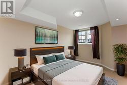 Second bedroom with large bright window - 