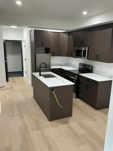 129 5Th Avenue, Swan River, MB - Indoor Photo Showing Kitchen With Upgraded Kitchen