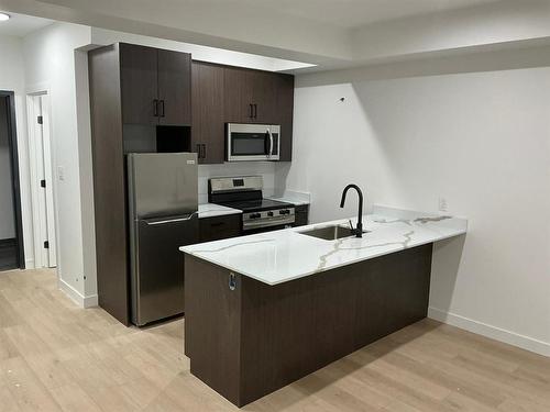 129 5Th Avenue, Swan River, MB - Indoor Photo Showing Kitchen