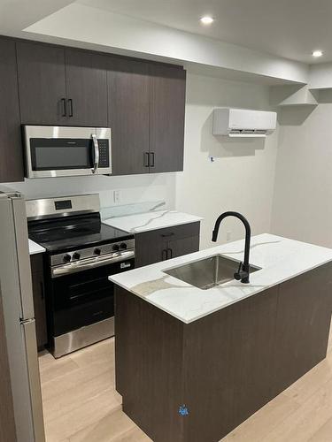 129 5Th Avenue, Swan River, MB - Indoor Photo Showing Kitchen With Double Sink