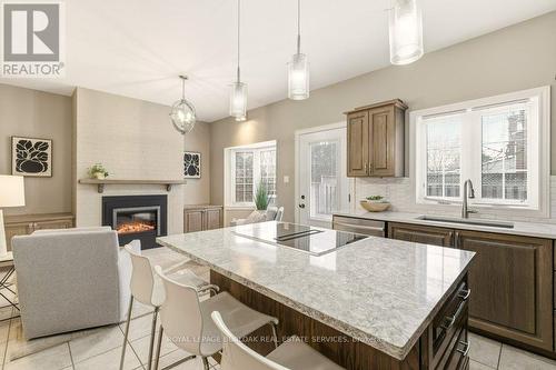 24 - 2407 Woodward Avenue, Burlington, ON - Indoor Photo Showing Kitchen With Fireplace With Double Sink