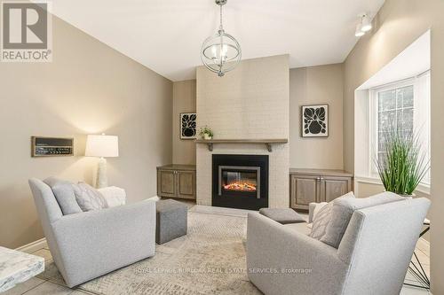 24 - 2407 Woodward Avenue, Burlington, ON - Indoor Photo Showing Living Room With Fireplace