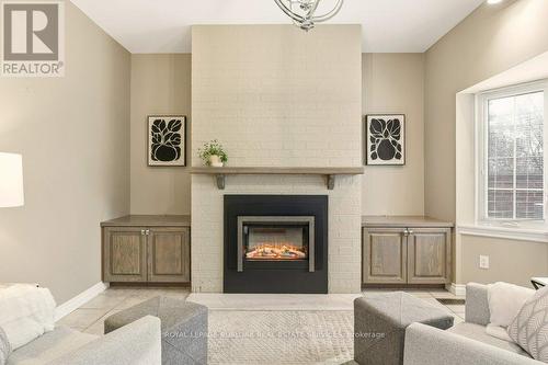24 - 2407 Woodward Avenue, Burlington, ON - Indoor Photo Showing Living Room With Fireplace